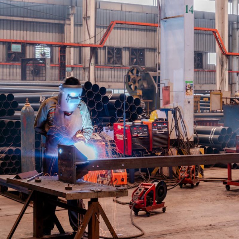 a person welding a piece of metal